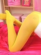 Busty british girl Shannon in hooters uniform and bright color pantyhose